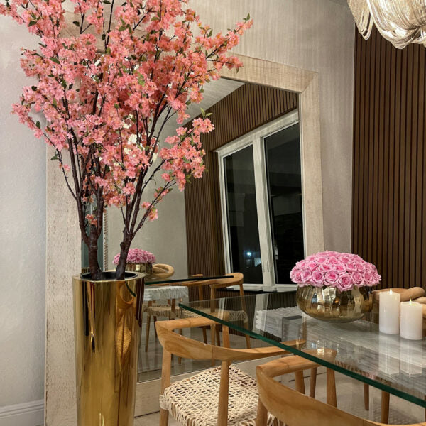 Large cherry blossom tree in a golden pot